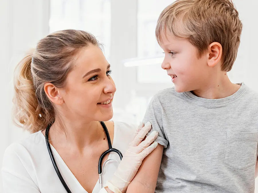 A nurse caring for a child during a wound dressing review